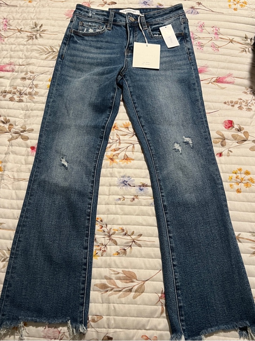 Mid-Rise Blue Bootcut Jeans with Raw Hem
